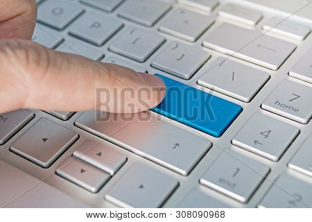 Close Up Of Computer Laptop Keyboard With A Blank Blue Button For Any Message And Copy Space. Concep