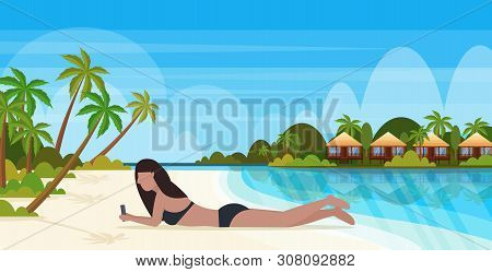 Bikini Woman Sunbathing Girl In Swimsuit Using Smartphone Social Media Communication Summer Vacation