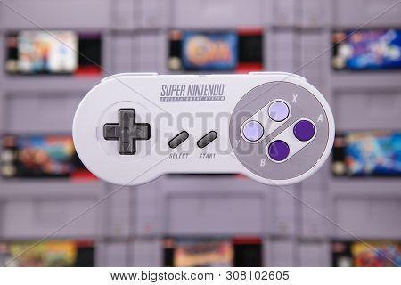 Taipei, Taiwan - June 19, 2019: A Nintendo Nes Mini System And Controller On Top Of A Pile Of Retro 