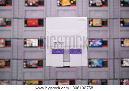 Taipei, Taiwan - June 19, 2019: A Nintendo Nes Mini System And Controller On Top Of A Pile Of Retro 
