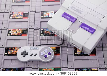 Taipei, Taiwan - June 19, 2019: A Nintendo Nes Mini System And Controller On Top Of A Pile Of Retro 