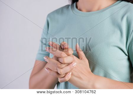 Healthcare And Medical Concept. Close Up Woman Cracking Knuckles.