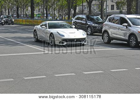 Kiev, Ukraine - May 3, 2019: White Ferrari F12 Berlinetta In The City