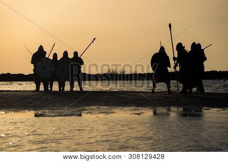 Slavic Warriors Reenactors With Wearpons And Shields Training Fighting Outdoors At Seaside