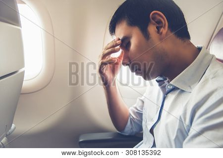 Male Passenger Feeling Dizzy Having Airsickness While Traveling On The Plane