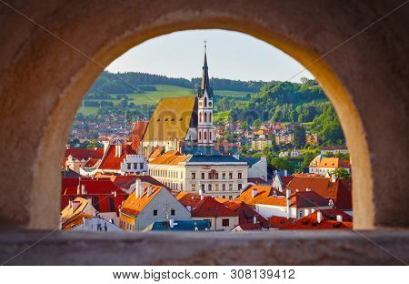 Czech Krumlov Czech Republic view at old town through window with arch. Landmark and traveling.