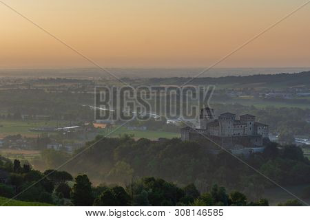 Early Morning Light On The Italian Hills, Ancient Castle Wrapped In A Light Morning Fog