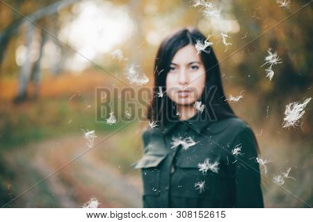 Dreamy Beautiful Girl In Airy White Fluff On Bokeh Background With Yellow Leaves. Inspired Girl In A