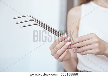 Girl Is Holding Stainless Steel Straws To Reduce The Amount Of Plastic Waste In The Environmen.