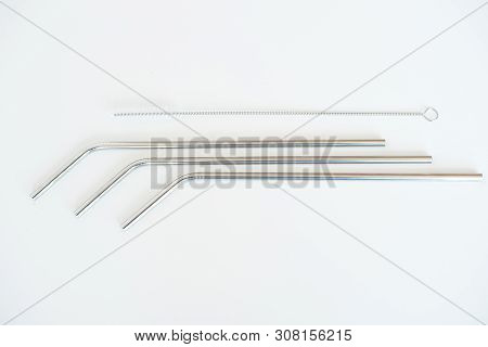 Lot Of Metal Tubes For Cocktails With Schutkoy For Cleaning Isolated On White.