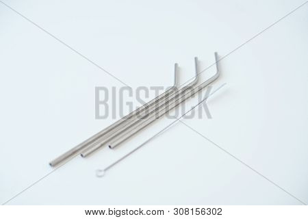 Lot Of Metal Tubes For Cocktails With Schutkoy For Cleaning Isolated On White.