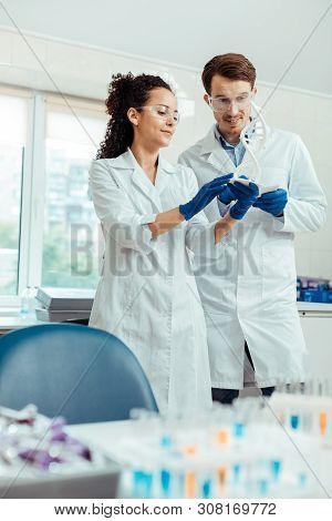 Positive Smart Scientists Working Together In Team