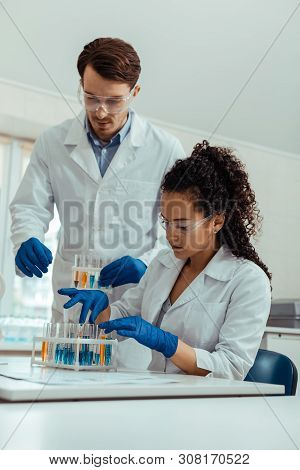 Professional Team Of Smart Scientists Working Together