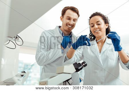 Happy Positive Biologists Conducting A Successful Research
