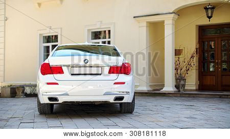Grodno, Belarus, May 16, 2013: Modern Luxury Bmw 750li Xdrive Car Rear Back View Parked On Stone Pav