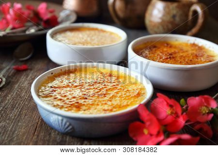 Creme Brulee, French Traditional Dessert, Three Portions. Rustic Style