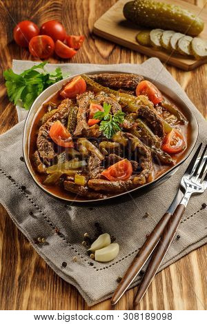 Traditional Tatar Dish Azu. Fragrant Beef Meat With Tomatoes And Pickles In A Thick Sauce In A Plate