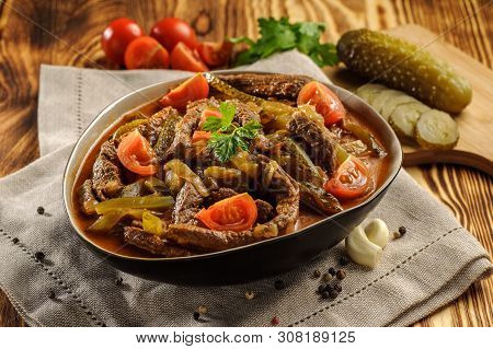 Traditional Tatar Dish Azu. Fragrant Beef Meat With Tomatoes And Pickles In A Thick Sauce In A Plate