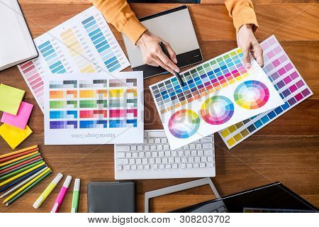 Image Of Female Creative Graphic Designer Working On Color Selection And Drawing On Graphics Tablet 