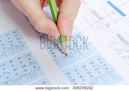 Child Is Doing Homework, Math, Close Up
