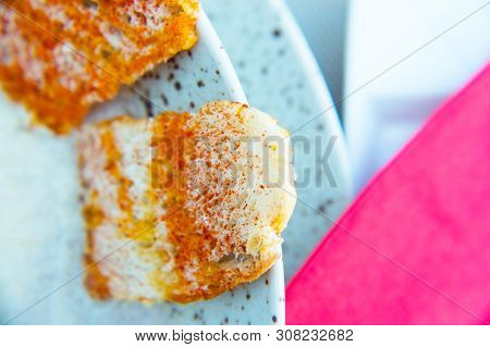 Peppery Crackers On A Plate With Cream Soup.