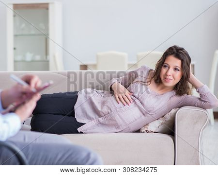 Pregnant woman visiting psychologist doctor