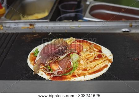 Tortilla Pizza On The Grill. Healthy And Hearty Food, Fajita With Grilled Ham, Vegetables, Fresh Sal