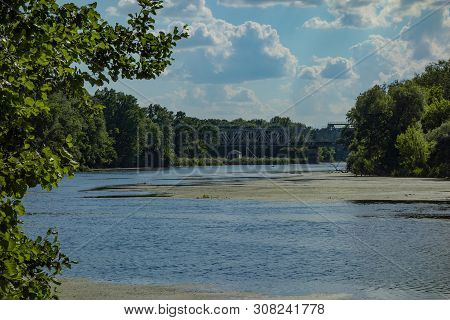 Blue River Water With Green Duckweed Lemna Plants. Ecology Problems Or Wildlife Nature Landscape