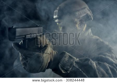 View From Clouds Of Smoke Of American Soldier Keeping Sight On Modern Gun Weapon And Shooting. Ranke