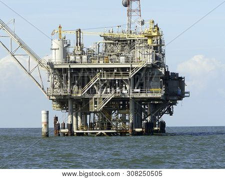 Oil Rig Near Dauphin Island, Alabama, Co-exists With Nature. This Natural Gas Field In Mobile Bay Is