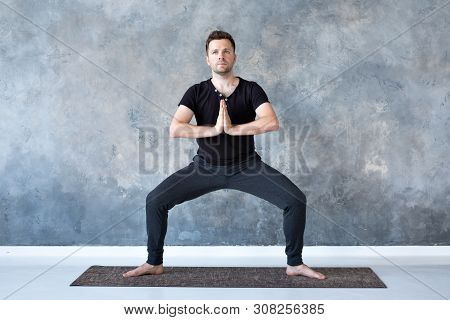 Man Working Out, Yoga, Pilates, Fitness Training, Goddess Pose Or Rudrasana