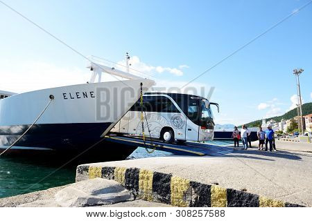 Igoumenitsa, Greece - May 17: The Corfu Ferry Is In Moorage And Bus Unloading On May 17, 2016 In Igo