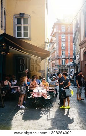 Strasbourg, France - July 22, 2017: Large Group Of People On Outdoor Restaurant Cafe Terrace On 6 Ru