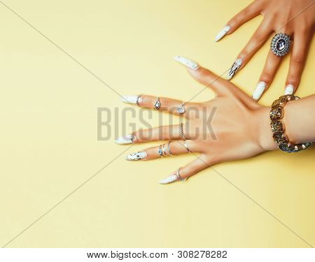 Woman Hands Holding Colorful Paper Copyspace Wearing A Lot Of Jewelry And Long Nails
