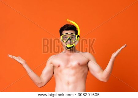 Waist Up Portrait Of A Young Shirtless Caucaisan Man Wearing Snorkel Doing Arms Raised Gesture In Is