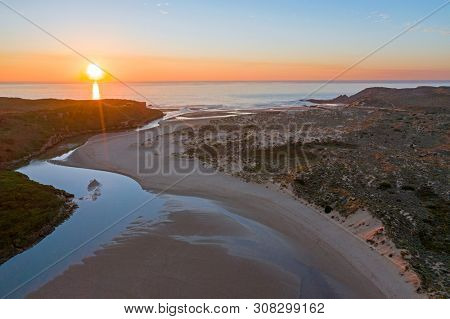 Aerial from Amoreira beach on the westcoast in Portugal at sunset