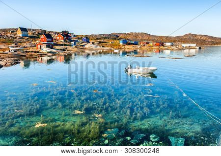 Beautiful Sea Coast And Colorful Houses On The Rocks In Oqaatsut Village, Western Greenland. Summer 
