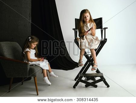 Interaction Of Children With Adult World. Cute Girls Trying To Do Bright Make Up For Being Older. Li