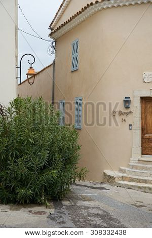 Mougins, France - April 03, 2019: The Sign With French Text Over The Door Says That Commander Lamy W