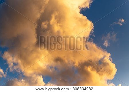 Golden Hour Cloud With A Deep Blue Background