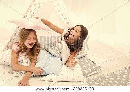 Pajamas Party For Kids. Girls Having Fun Tipi House. Girlish Leisure. Sisters Share Gossips Having F