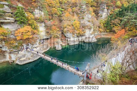 Rope Bridge Cross To Vibrant Cliff With Mirror Lake In To-no-hetsuri - Shimogo, Fukushima, Japan