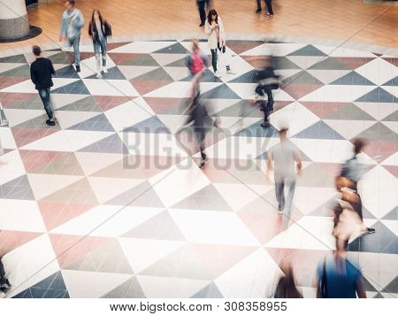 People In Motion At The Modern Shopping Mall.