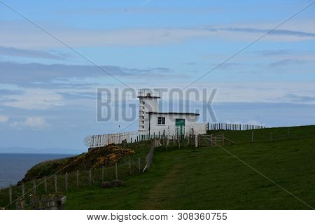 White Coastguard Station Located On St Bees Head On The Irish Sea.