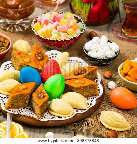 Colored Eggs, Wheat Springs And Sweet Pastry For Novruz Holiday In Azerbaijan. Selective Focus.