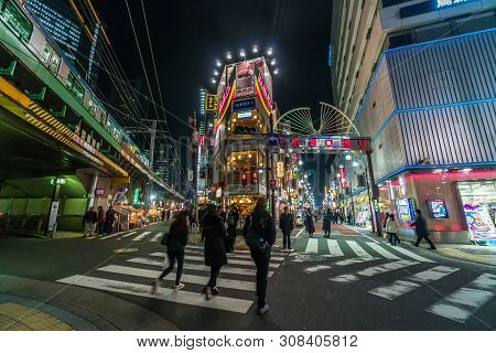Tokyo, Japan - Feb 2019 : Crowds Undefined People Walking Around Night Market Street At Shimbashi St