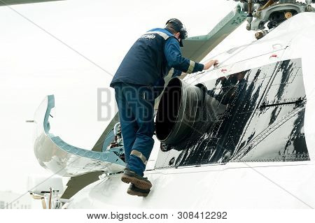 Tyumen, Russia - June 19, 2019: Aircraft Repair Helicopter Utair Engineering Plant. Male Mechanic In