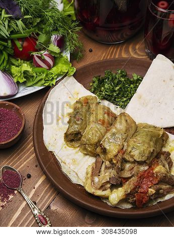 Kelem Dolmasi, Cabbage Leaves Stuffed With Meat And Rice, With Beef Stew With Vegetables In Lavash. 