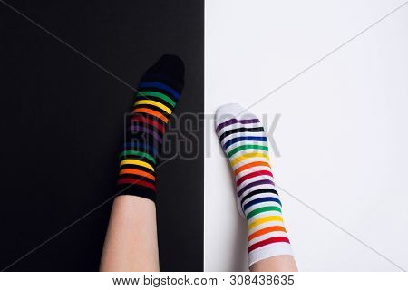 Two Nagative Legs With White And Black Striped Colorful Socks With Negative Background With Copy Spa