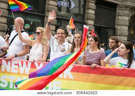 2018 JUNE 24 NEW YORK: Democratic New York Governor Andrew Cuomo and supporters march along the 5th Ave parade route during the NYC Pride March.